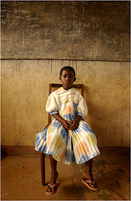 A young Ghanaian girl wears her finest clothes as she waits to see American doctors from Navy Fleet Hospital Minneapolis