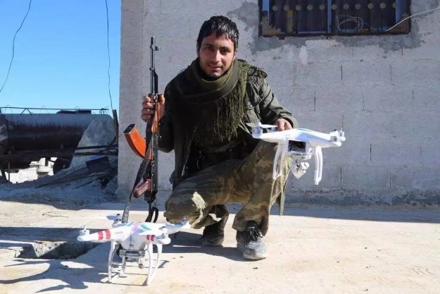 File:Soldier with commercial drones.jpg