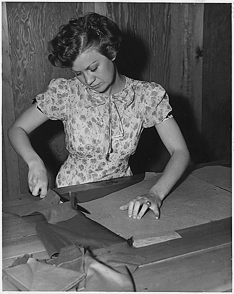 File:Young Woman Learning to Sew 1936.gif