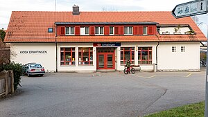 White building with red tiled roof