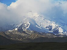 The top of McKinley is shrouded in clouds.