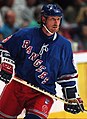 Image 4 Wayne Gretzky Photo credit: Håkan Dahlström Ice hockey player Wayne Gretzky, as a member of the New York Rangers of the National Hockey League (NHL) in 1997. Gretzky, nicknamed "The Great One", is widely considered the best hockey player of all time. Upon his retirement in 1999, he held forty regular-season records, fifteen playoff records, and six All-Star records. He is the only NHL player to total over 200 points in one season—a feat he accomplished four times. In addition, he tallied over 100 points in 15 NHL seasons, 13 of them consecutively. He is the only player to have his number (99) officially retired by the NHL for all teams. More selected portraits