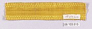 A length of plain, bright gold braid with a zigzag border