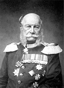 Photograph of an elderly Wilhelm, a bald man with side whiskers