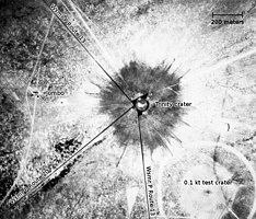 An aerial photograph of the Trinity crater shortly after the test.[note 2]