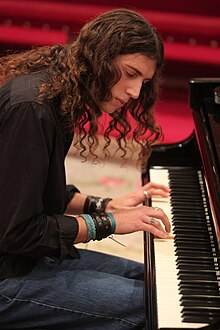 Joe Atlan playing a piano concert at University of Navarre in 2011.