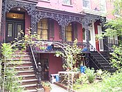 Italianate townhouses[115] on East 18th Street (1853), with cast-iron verandas reminiscent of the French Quarter of New Orleans.[114]