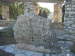 An engraved rock at the top of Mount Bonnell