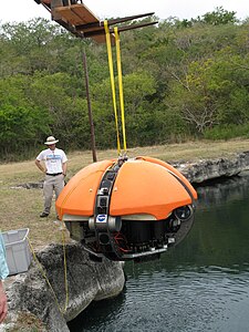 Deep Phreatic Thermal Explorer (DEPTHX) robot being lowered into La Pilita, one of several water-filled sinkholes in Sistema Zacaton in Tamaulipas, Mexico (2007)