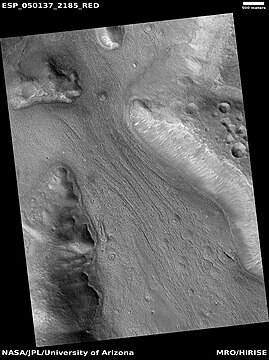 Lineated valley fill in valley, as seen by HiRISE under HiWish program Linear valley flow is ice covered by debris. Location is Ismenius Lacus quadrangle.