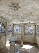 Inside the central fountain of the courtyard, where water originally sprayed down from the ceiling