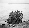 Men of the 15th Scottish Division leave their assault craft after crossing the Rhine on 24March 1945