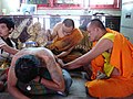 Hlwong Pi Nan tattooing Yant at Wat Bang Phra Temple