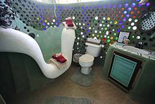 Bottle walls are used in earthships such as this earthship bathroom, located in Phoenix Earthship, Taos, NM, USA.