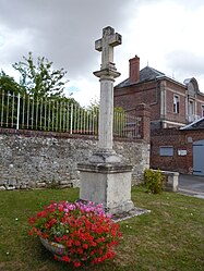 The cross with the town hall in the background