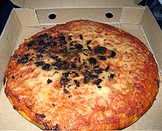 Deep-fried pizza, also known as a "pizza crunch" in Scotland.