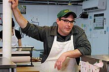 Tom leaning on the counter at his butcher shop, the Meat Hook, in Williamsburg, Brooklyn Tom Mylan