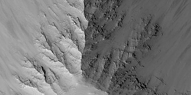 Close view of layers in Louros Valles, as seen by HiRISE under HiWish program. Note this is an enlargement of a previous image.