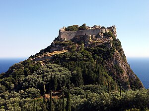 Photo of a hilltop fortress with the sea in the background