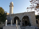 The entrance side with a Shiite cemetery