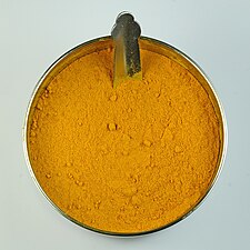 Turmeric powder, first used as a dye, and later as a medicine and spice in South Asian cuisine.