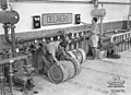 Australian troops using captured Italian 200 L drums and filling equipment, Tobruk, Libya 1941