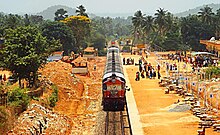 Train at an open-air station, viewed from above