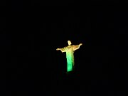 The statue illuminated in yellow and green, the colors of Brazil, during the 2014 FIFA World Cup.