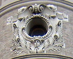 Detail of oculus set in a cartouche with the head of Mercury (Beaux-Arts New York and New Jersey Telephone Company Building, Brooklyn)