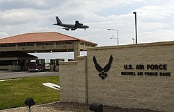 The main gate at MacDill AFB, with a KC-135R Stratotanker overhead.