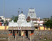 image of a temple tower with a tank and a pillared hall in its centre