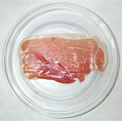 A slice of jamón serrano