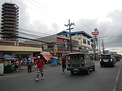 A 7-Eleven and Jollibee in Trece Martires City