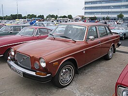 1975 164 front illustrating updated front bumper, grille and redesigned doors.