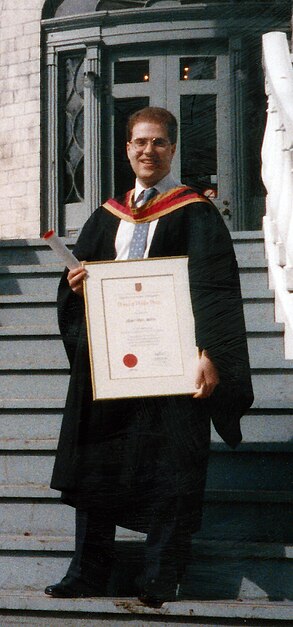 David Siderovski, outside Summerhill House (Queen's University, Kingston, ON), holding the 1989 Prince of Wales Prize