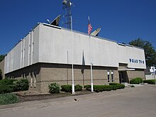 A two-story 1960s-vintage building with WQAD TV signage