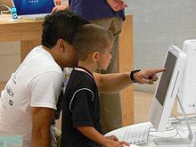 A parent and child engage in joint attention through pointing.