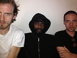 Death Grips in January 2014. From left to right: Zach Hill, MC Ride, and Andy Morin.