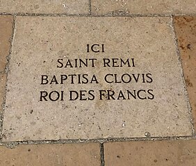 Paving stone in cathedral nave commemorating baptism of Clovis by Saint Remi