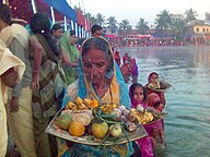 Women giving aragh on Chhath Puja Malangwa, Nepal