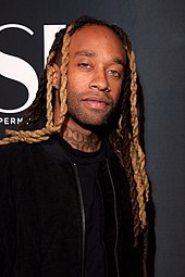 Ty Dolla Sign in a black jacket and t-shirt