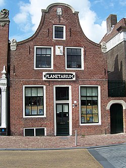 Canalside house with "Planetarium" on the gable