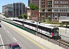 A MetroLink train passing downtown Clayton, MO