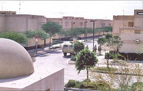 Saudi city of Khafji before the Iraqi offensive, U.S. Marines and an armored vehicle shown on patrol