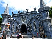 The haunted castle-themed building facade that serves as Scooby-Doo Spooky Coaster's entrance.