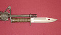 U.S. M9 bayonet with clip-point blade, sawteeth along the spine, and can be used as a wire-cutter when combined with its steel scabbard