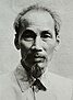 A thin-faced man with a long beard wearing traditional clothing