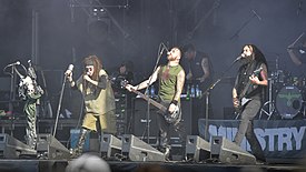 Ministry at Hellfest in 2017. From left to right: Al Jourgensen, Jason Christopher and Cesar Soto. Keyboardist John Bechdel is at the background.