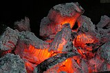 Smouldering embers glow from the heat released by oxidative combustion. A fire in which there is no visible flame, and the combustion takes place in or near the solid, is referred to as a smouldering fire.