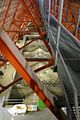 Inside the roofspace steel girders rise above the stone vaulting.